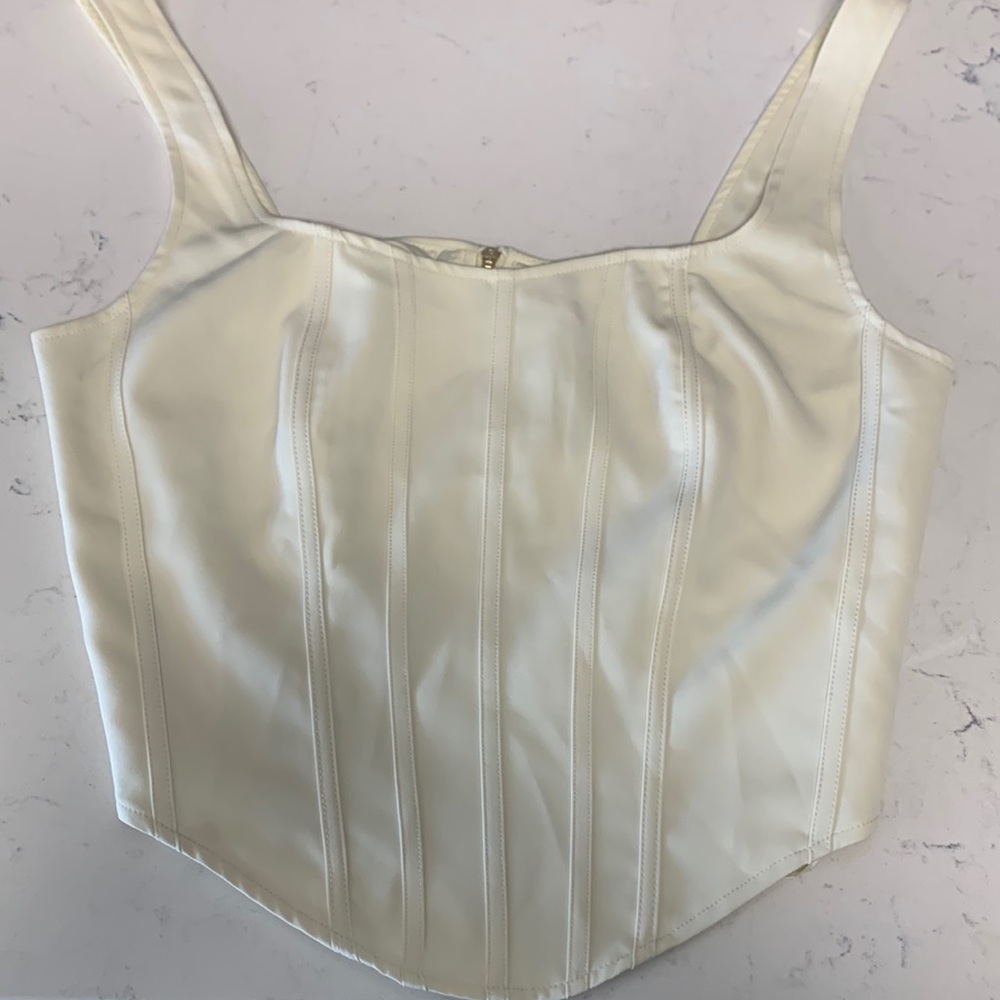 Cream corset style top. Size L.